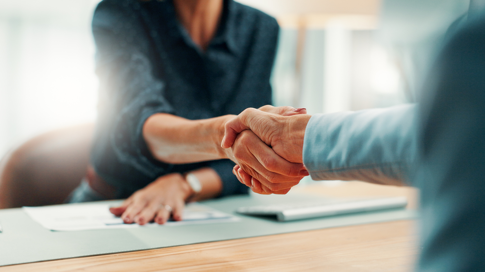 handshake_deal_and_business_people_in_office_with_agreement